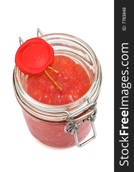 Red caviar in glass can on a white background