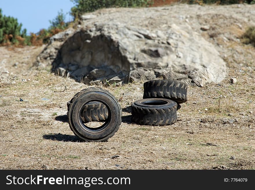 Abandoned tires in countryside with shallow depth of field