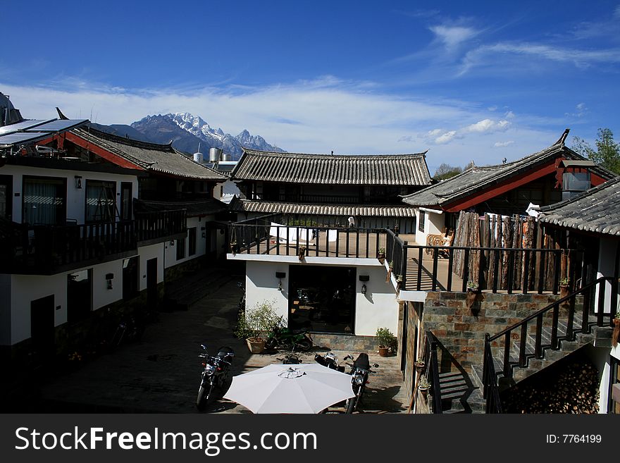 Yulong Snow Mountain stands beside the Jinshajiang River, northwest of the Lijiang Naxi Autonomous County, Yunnan Province. Shanzidou, the main peak of the mountain, clad in white snow all year round, rises 5,596 meters above sea level. The 13 peaks, distributed from the south to the north, with the south-north length of 35 km and the east-west width of 12 km, are like a silver white jade dragon lying in the clouds, hence the name Yulong (jade dragon) Snow Mountain