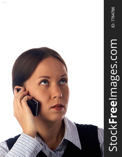 Young business woman speaking by a sell phone. Young business woman speaking by a sell phone