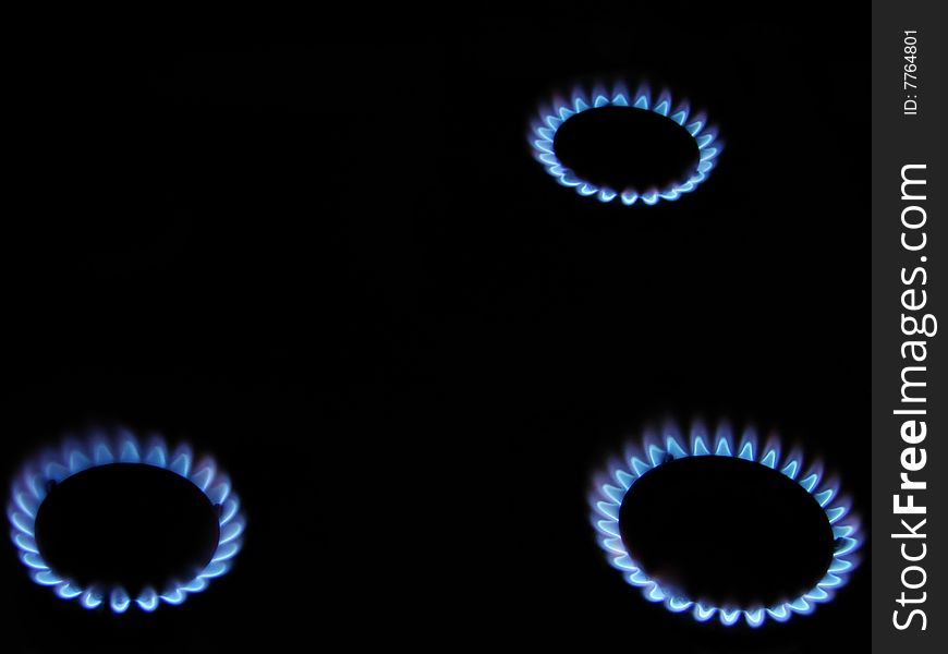 Flames of gas stove in the dark