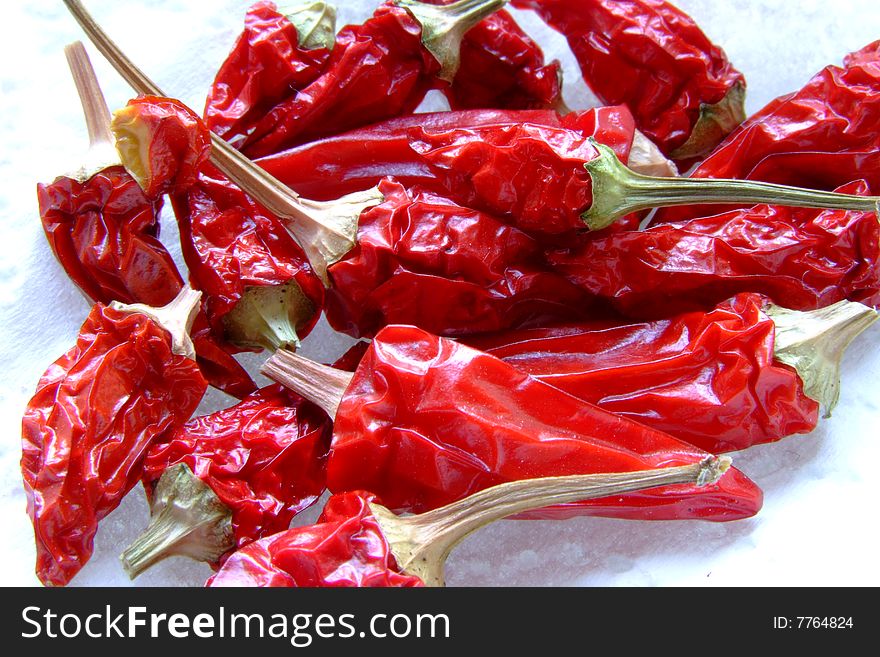 A cluster of red hot peppers ready to be added to food or served