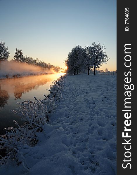 Foggy river during sunrise of a winters day. Foggy river during sunrise of a winters day