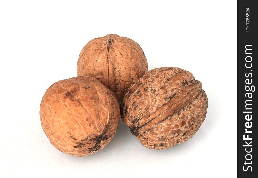 Photo of three nuts on white