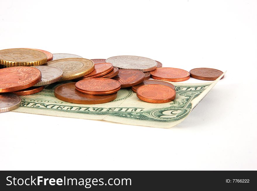 Five dollar paper money with worldwide coins isolated on the white background. Five dollar paper money with worldwide coins isolated on the white background.