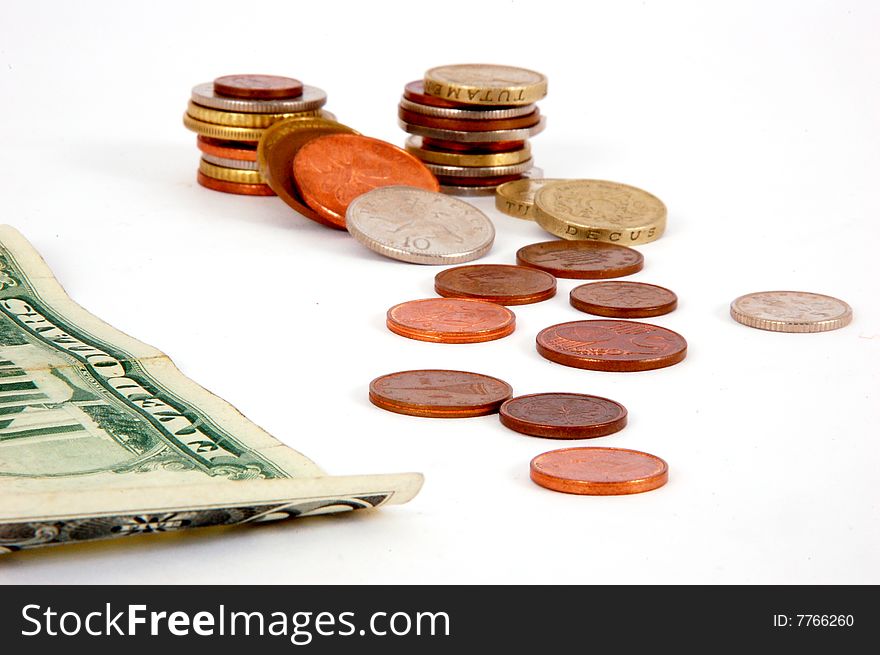 Five dollar paper money with worldwide coins isolated on the white background. Five dollar paper money with worldwide coins isolated on the white background.