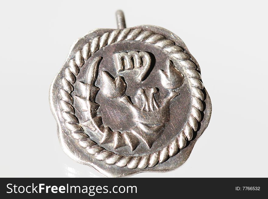 Silver pendant with a zodiac sign. Silver pendant with a zodiac sign