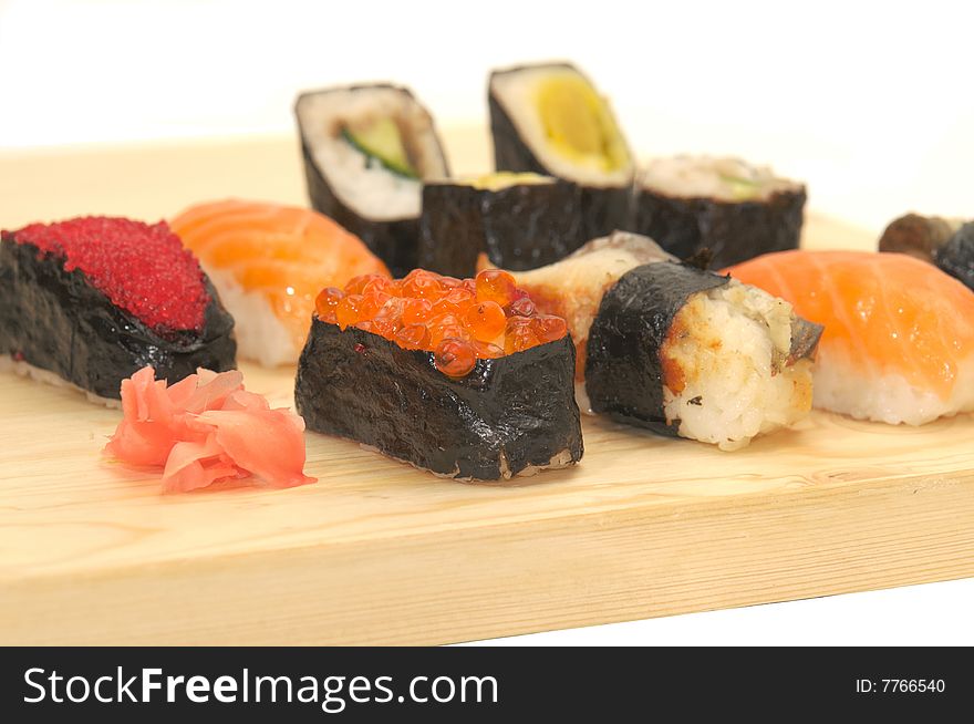 Classic japanese meal - sushi with differend kinds of fresh fish: salmon, tuna, butterfish