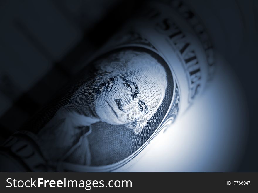 Spotlight on dollar bill focused on Washington. Spotlight on dollar bill focused on Washington