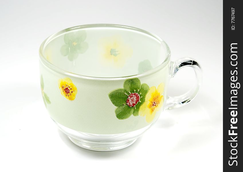 Tea transparent cup with an ornament from green colours