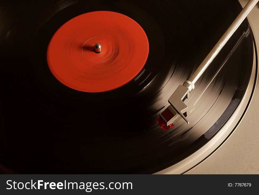 Photo of Vintage vinyl record with red label. Photo of Vintage vinyl record with red label