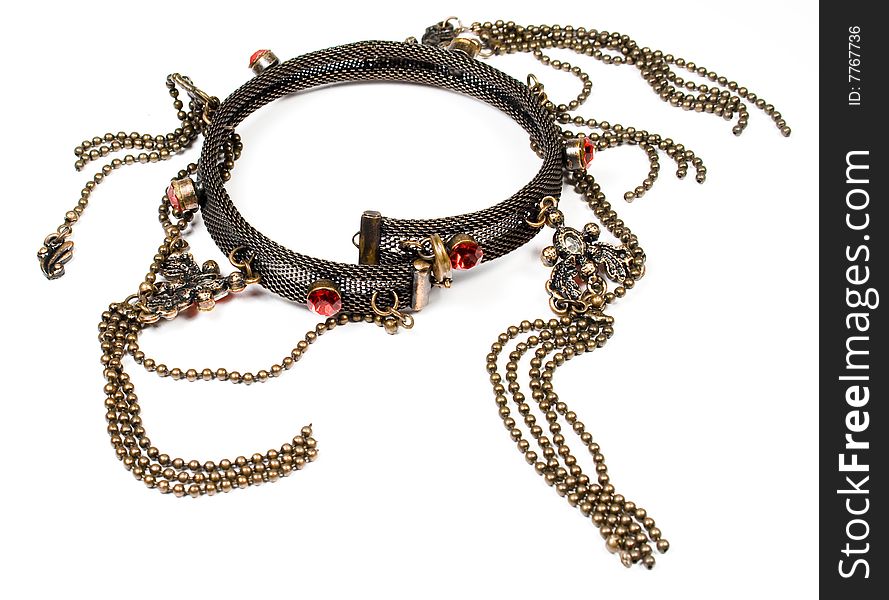 Bracelet from a beads of brown colour, metal and jewels of red colour