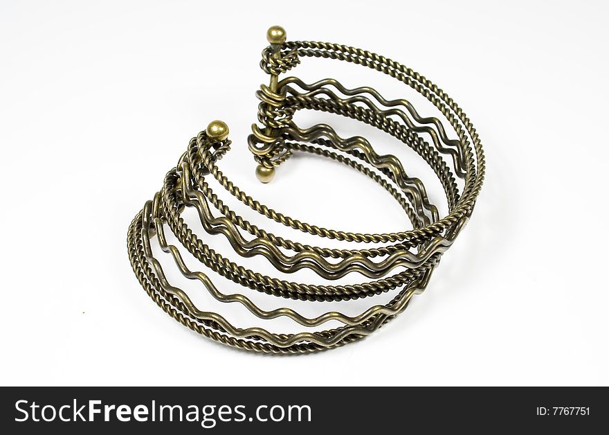 Bracelet from bronze metal with ornament on white