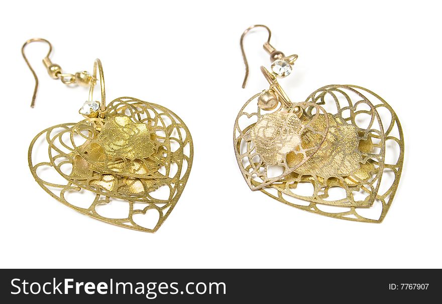 Earrings from gold in the form of heart on white