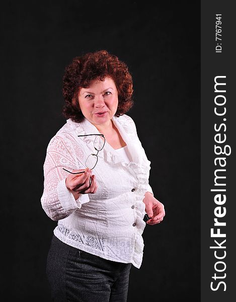Business woman on black background in studio