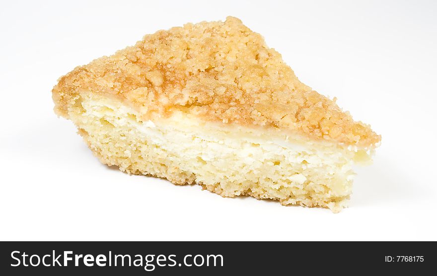 Piece of a pie from cottage cheese on white