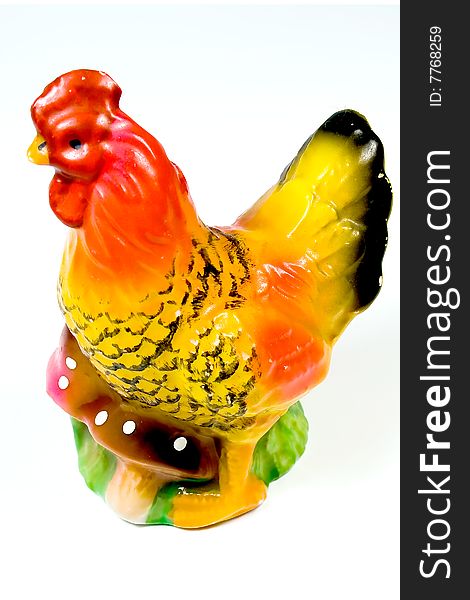 Saltcellar in the form of a cock on white