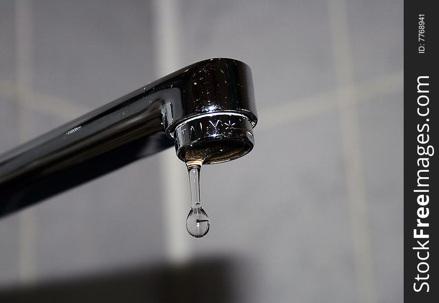 Chrome faucet with water drop. Chrome faucet with water drop