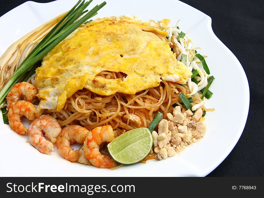Fried rice noodles with shrimps and vegetables. Fried rice noodles with shrimps and vegetables...