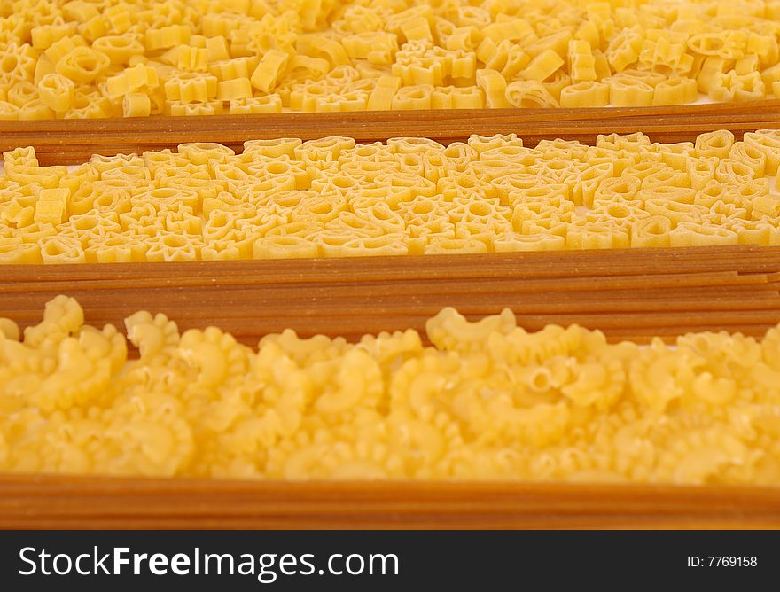 Raw macaroni collection as close-up food background. Raw macaroni collection as close-up food background