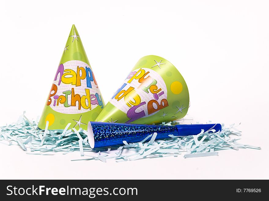 Party hats and paper horns on a white background