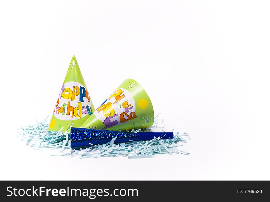 Party hats and paper horns on a white background