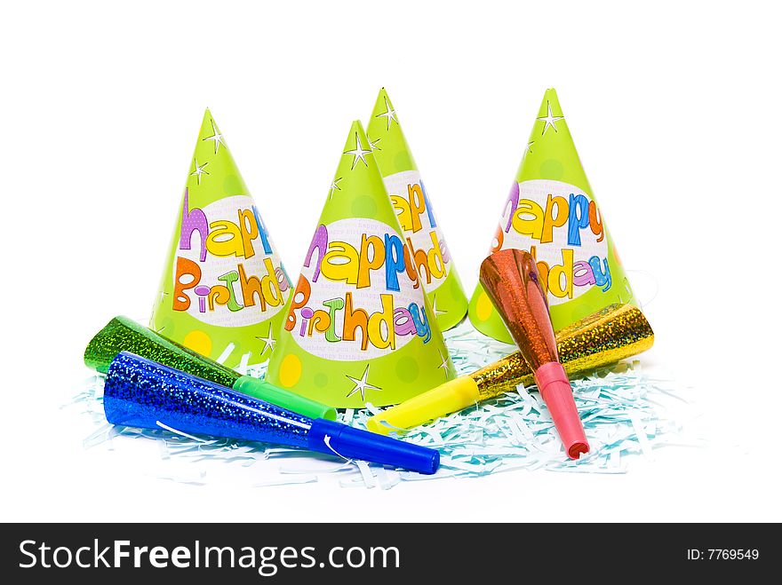 Party hats and paper horns on a white background