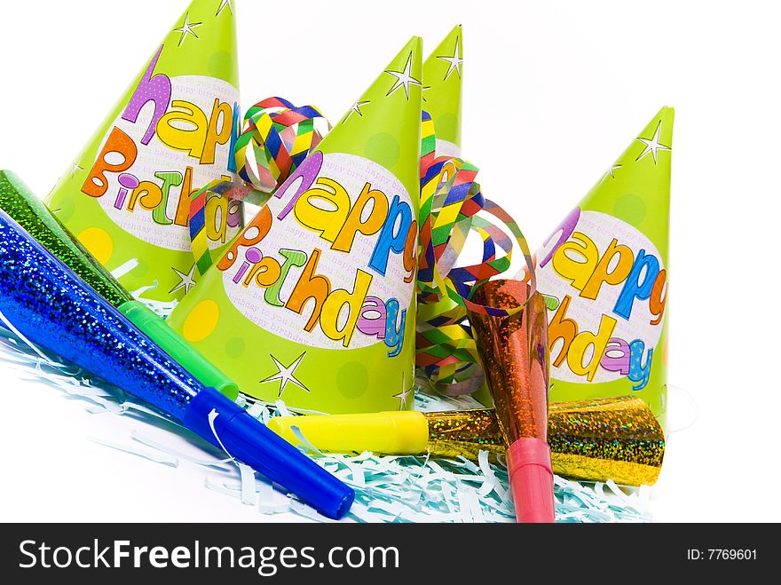 Party hats and paper horns on a white background