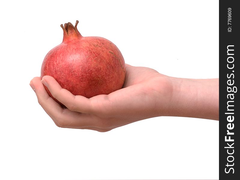 Girl's hand with pomegranate isolated on white background