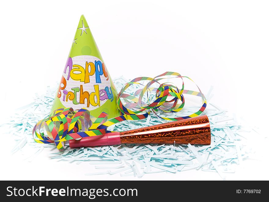 Party hats and paper horns on a white background