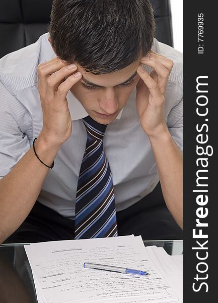 Student when studying, sitting in front of the scripts and documents