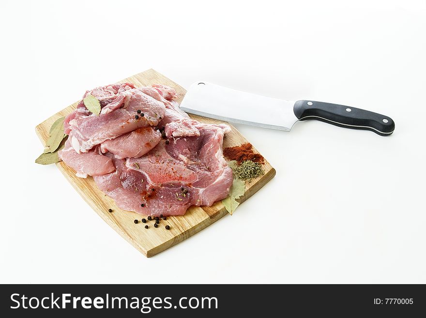 Raw pork meat with knife on a wooden board. Raw pork meat with knife on a wooden board
