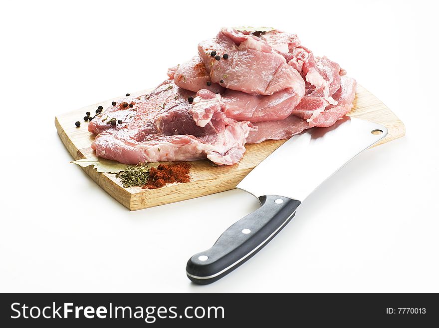 Raw pork meat with knife on a wooden board. Raw pork meat with knife on a wooden board