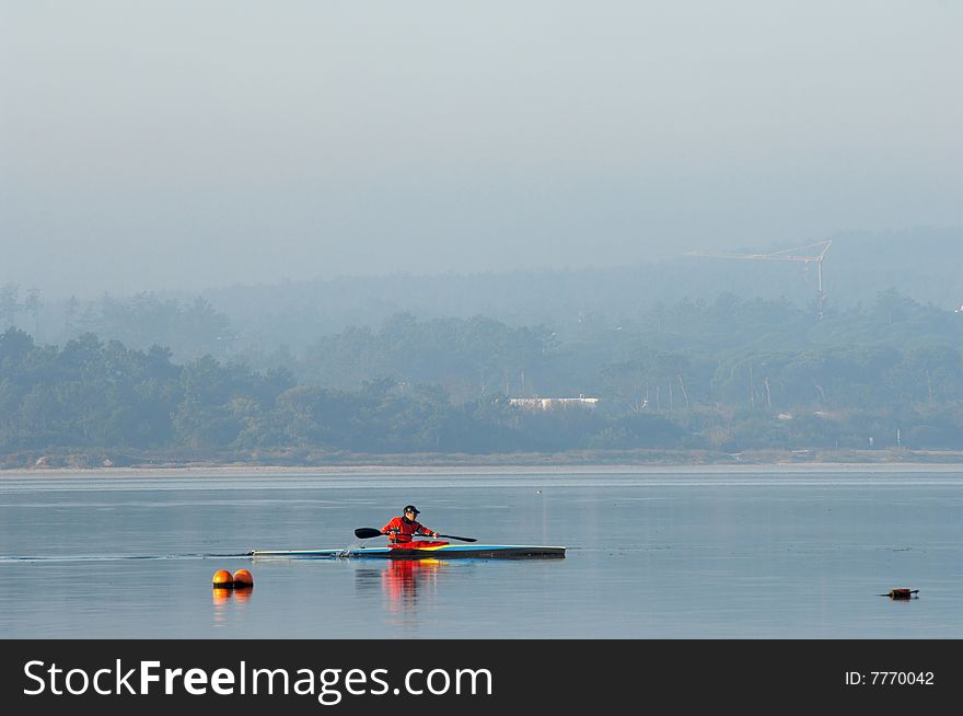 Sillouette of man kayaking