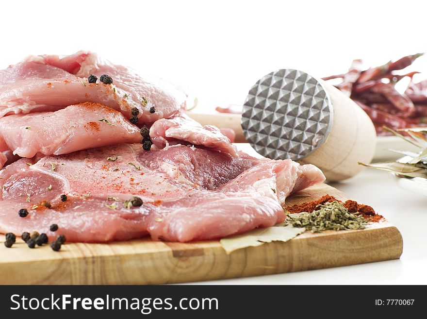 Raw pork meat ready for cooking on a white background. Raw pork meat ready for cooking on a white background