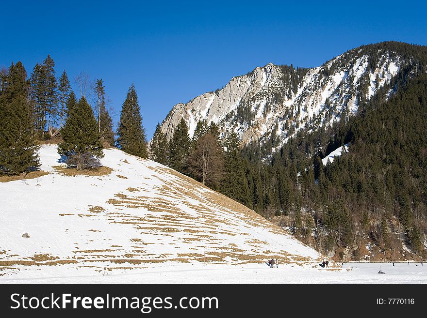 Winter mountain landscape with blue sky