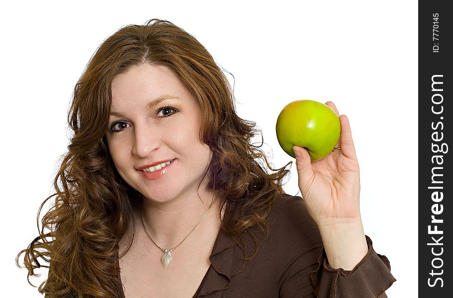Pretty Woman Smiling and Holding a Fresh Green Apple symbolizing healthy eating and living. Pretty Woman Smiling and Holding a Fresh Green Apple symbolizing healthy eating and living