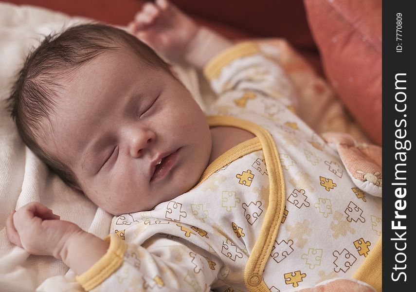 Newborn baby lying on its back and sleeping. Newborn baby lying on its back and sleeping.