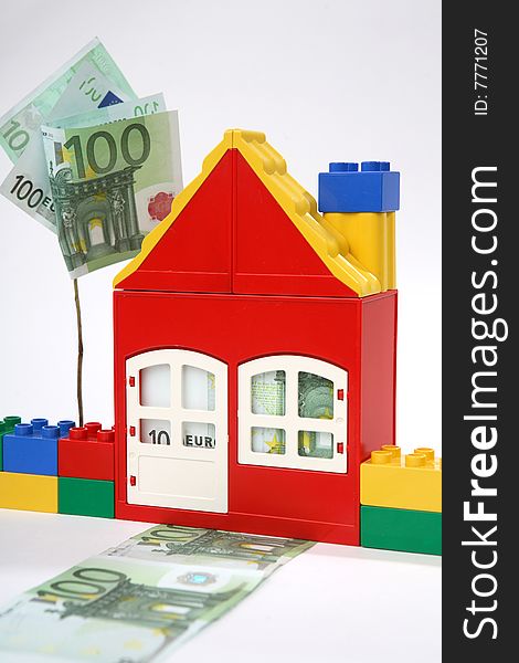 House with banknotes  - save money.