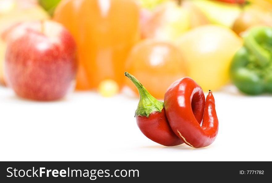 pepper on a background of vegetables and fruits. pepper on a background of vegetables and fruits.