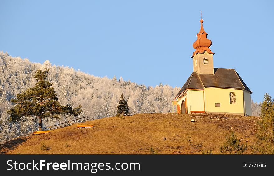 Small chapel in the mountains in sunset light. Small chapel in the mountains in sunset light