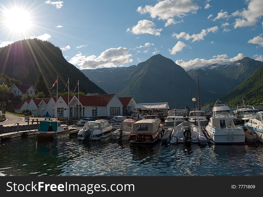 Idyllic marina in Balestrand, situated at the Northern coast of Sognefjord in Western Norway. Idyllic marina in Balestrand, situated at the Northern coast of Sognefjord in Western Norway.