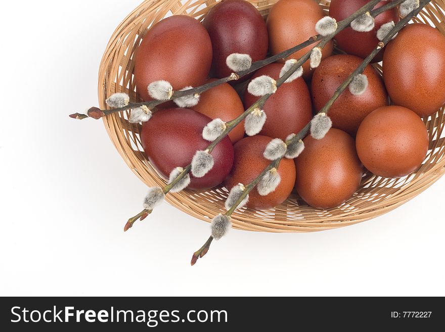 Easter eggs in a basket in a white background