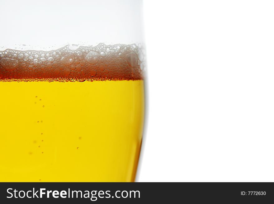 Pint of beer closeup isolated on white with space for text