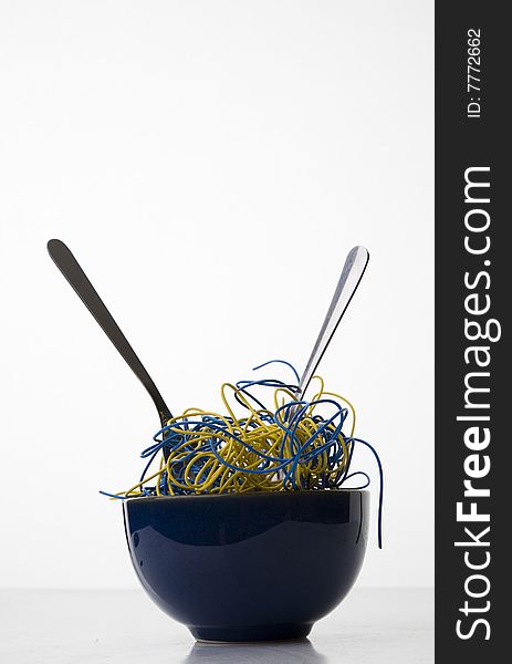 Bowl of Noodles Made of Blue and Yellow Computer Wires - Concept of Synthetic Food isolated on White. Bowl of Noodles Made of Blue and Yellow Computer Wires - Concept of Synthetic Food isolated on White