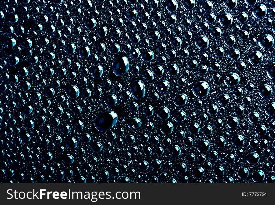 Some water drops on black background