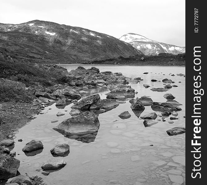 Black-and-white picture of a lake in the Strynefjell mountains in Norway. Black-and-white picture of a lake in the Strynefjell mountains in Norway.