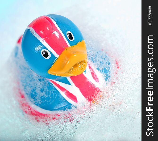 Rubber duck against a bubbly blue background