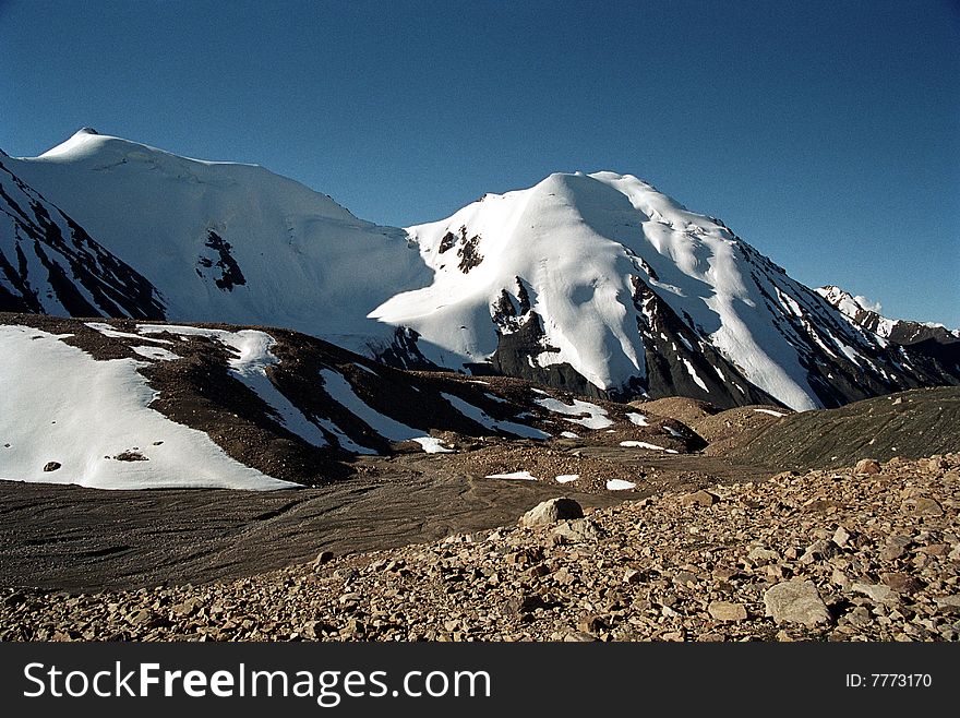 The mountain landscape near the Mashkovtsev glacier at Northern Tien Shan. The mountain landscape near the Mashkovtsev glacier at Northern Tien Shan.