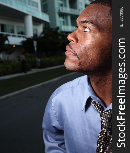 Profile headshot of a man looking away